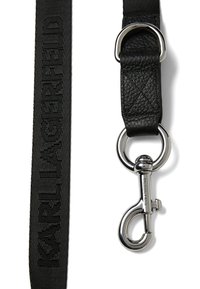 Black dog leash with woven fabric, featuring embossed "KARL LAGERFELD" logo, leather handle, and silver metal clip for attachment.