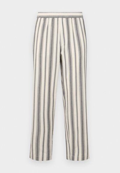 Striped pants in a light cream color with thin gray vertical stripes. Features an elastic waistband and a straight leg cut.