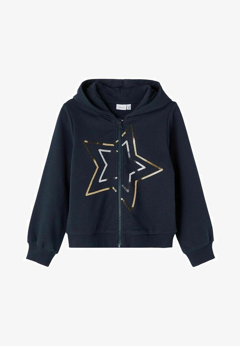 Sweat à capuche zippé pour enfants en bleu marine, avec capuche, poignets côtelés et un motif en sequins dorés et blancs en forme d'étoile sur le devant.