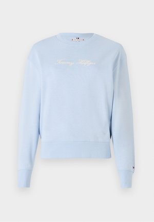 Svetlo modrá mikina s okrúhlym výstrihom, s pružnými manžetami a spodným lemom. Na prednej strane sa nachádza vyšívané logo "Tommy Hilfiger" v bielej farbe. Má jemnú textúru.