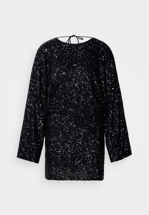Black, long-sleeve dress covered in sequins, features a rounded neckline and a tie at the back. Loose fit with a smooth texture.