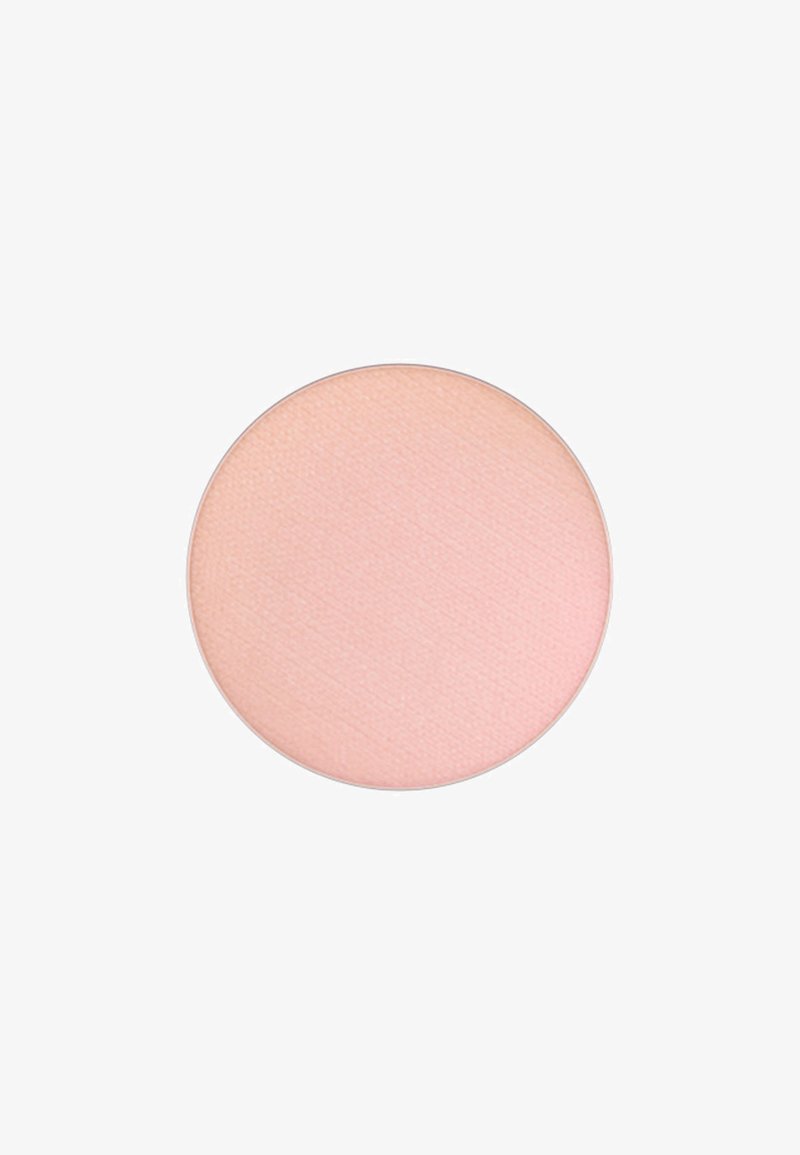 Compact rond, de couleur rose pâle avec une texture lisse ; léger éclat ; design minimaliste, sans marque ni motifs visibles.