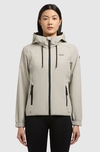 Heled hall hoodie, mille ees on tõmblukk, reguleeritavad nöörid ning kaks tõmblukuga küljetaskut. Elastsed mansetid ja minimaalne bränding. Sile tekstuur.