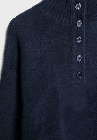 Navy blue collar sweater made of textured fabric, featuring a ribbed neck and six black buttons down the front.
