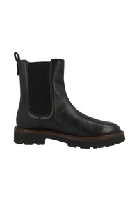 Botín Chelsea de piel negra con panel lateral elástico, tirador en el talón, ribete marrón sobre suela de goma negra gruesa.