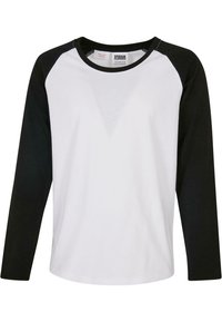 Langærmet t-shirt lavet af bomuld, med en hvid krop og sorte raglanærmer. Rund halsudskæring, blød tekstur og minimal detaljer.