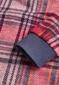 Next Strikkjoler - red