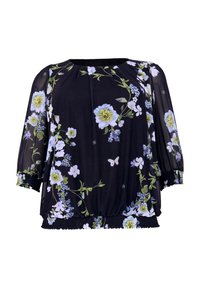 Sort blomsterbluse med korte, puffede ærmer. Har store blå og grønne blomster samt en smocket talje i et let, gennemsigtigt stof.