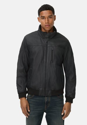 Black leather bomber jacket with a zip closure, high collar, and ribbed cuffs. Features a chest pocket and smooth texture.