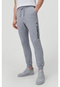 Gray sweatpants made of soft cotton blend fabric, featuring a tapered fit, ribbed cuffs, and a large black "O'Neill" logo on the side.