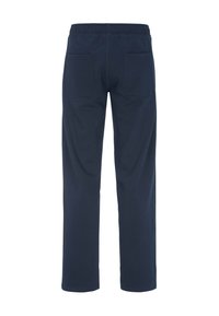 Diep marineblauwe sweatpants met een elastische tailleband, twee achterzakken en een recht gesneden ontwerp, gemaakt van een zachte, textuurrijke stof.