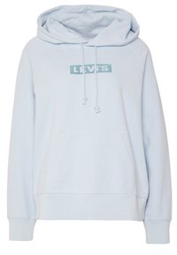 Ljusblå hoodie i bomullsblandning. Har en framficka, dragsko i huvan och Levi's-logotyp på bröstet i turkos.