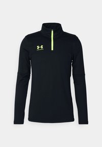 Svart långärmad tröja med fjärdedels dragkedja i elastisk tyg, med en neongrön dragkedja och logotyp på bröstet, slät yta och atletisk passform.