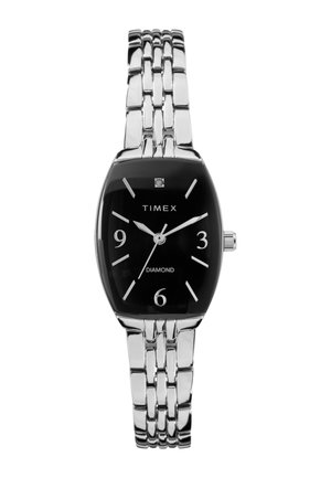 Damski zegarek Timex na srebrnej metalowej bransolecie z czarną prostokątną tarczą, srebrnymi indeksami godzin i ozdobą diamentową na godzinie 12.