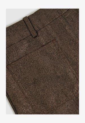 Brown textured fabric with a metallic sheen, featuring a back pocket and a belt loop at the waistband.