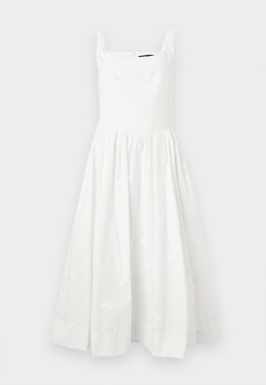 Balta bezpiedurkņu kleita ar kvadrātveida dekoltē un izšūtām ziedu detaļām. Pilna, savilkta svārku daļa un neredzamā rāvējslēdzēja aizdare aizmugurē.