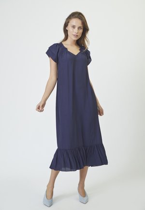 Rochie midi bleumarin cu mâneci scurte voluminoase, decolteu în V și tiv volăntat. Materialul pare neted și ușor.