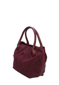 Borsa in suede color marrone con dettagli in pelle, manici robusti, forma arrotondata e un logo discreto sul davanti. Superficie texturizzata con una finitura morbida.