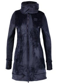 Giacca in pile nera lunga e morbida con colletto alto, zip frontale completa, tasche laterali con zip e aperture per i pollice sulle maniche.