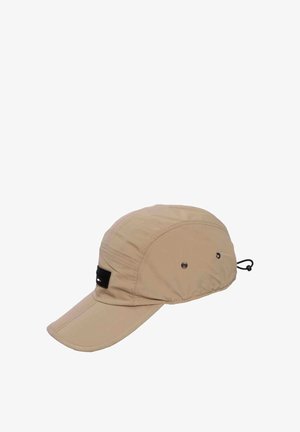 Beige lightweight cap with a curved brim, ventilation holes, black adjustable cord at the back, and a small black logo patch on the side.