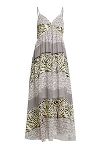 Maxiklänning med spagettiband, figursydd bodice och ett lagerdesign med grafiska mönster i svart, vitt och grönt.