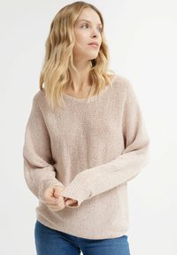 Light pink knit sweater with a loose fit, wide round neckline, and ribbed cuffs. Its texture features a subtle open weave pattern.
