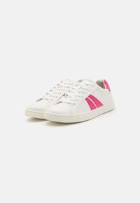 White leather sneakers with pink accents and stripes. Features a round toe, lace-up front, and textured rubber sole.