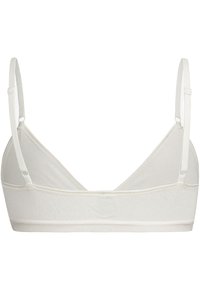 Lichtbeige bralette met verstelbare dunne bandjes, zacht materiaal, een eenvoudig ontwerp en een naadloze afwerking. Geen beugel of vulling.