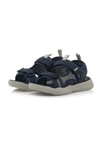 Sandalias azul marino con correas de malla y tela, cierres de velcro ajustables y suelas texturizadas grises diseñadas para comodidad y tracción.