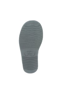 Grijze rubberen zool met gestructureerde grip patronen en een contourvorm. Kenmerkt de reliëftekst "WARMBAT AUSTRALIA."