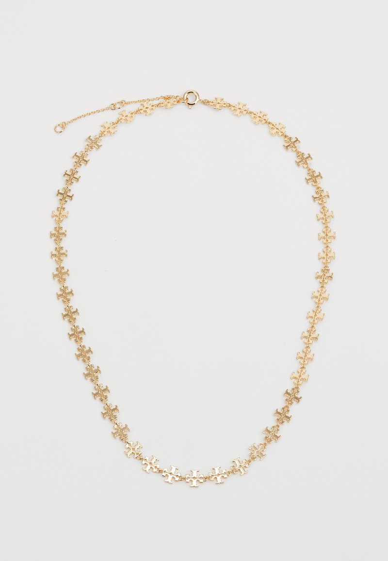 Zelts ar zelta krāsas ķēdīti, kas sastāv no savstarpēji savienotām puzles gabalu formām, ar gludu virsmu, smalku ķēdīti un omā ikonu, kas pielāgojams garumam.