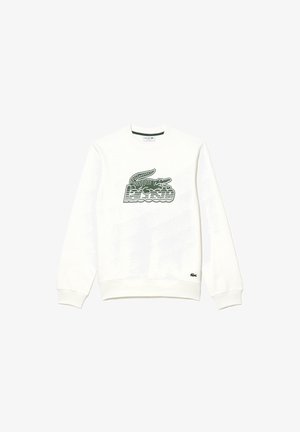 Sweat-shirt blanc à manches longues avec logo Lacoste rayé vert et graphisme de crocodile centrés sur la poitrine, poignets et ourlet côtelés.