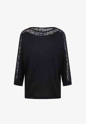 T-shirt noir à manches 3/4, présentant un tissu en dentelle transparent sur les épaules et le col, texture lisse et coupe décontractée.