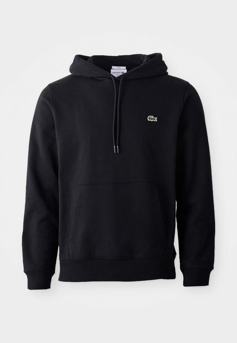 Sweat à capuche noir avec poche avant et petit logo crocodile vert sur la poitrine gauche, présenté sur fond blanc.
