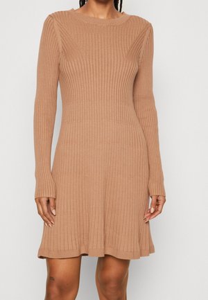 Long-sleeve ribbed dress in beige with a fitted bodice and flared hem. Features a round neckline and stretchy knit material.
