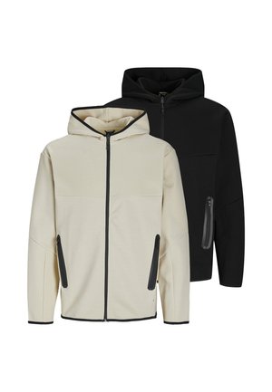 Two hooded sweatshirts, one cream and one black, both with front zippers, side zippered pockets, and contrasting trim along edges.