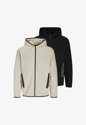 Dwie bluzy z kapturem, jedna kremowa, a druga czarna, obie z zamkiem błyskawicznym z przodu, bocznymi kieszeniami na zamek błyskawiczny oraz kontrastowymi wykończeniami na brzegach.