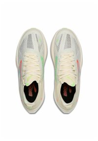 Light beige mesh running shoes with a textured upper, neon green and orange accents, and flat laces. Brooks logo on the side.