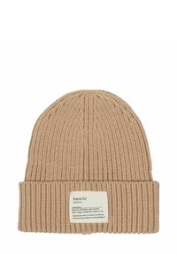 Beige ribbed knit beanie with folded cuff featuring a fabric label defining "thank-ful" and listing synonyms and its meaning.