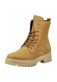 Tan suede ankle boots with a chunky beige sole, round toe, and brown laces. Features eyelet holes and a loop at the back for easy wear.