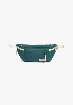 Kleine grüne Bauchtasche mit Fronttasche, weißen Reißverschlüssen, verstellbarem weißen Gurt und Eastpak-Logo auf der Fronttasche.