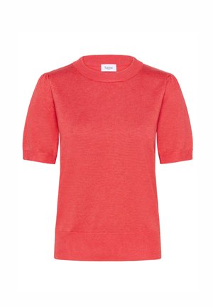 Koralline lühikeste varrukatega kudum, millel on ümmargune kaelus. Sile tekstuur, veidi lõtv istuvus ning soonikkoes ääred varrukatel ja alläärel.