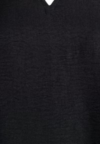 Black V-neck top made from lightweight fabric. Features a smooth texture with a subtle sheen, and minimal stitching detail around the neckline.