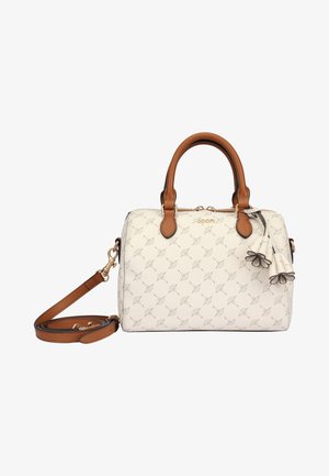 Krémově zbarvená kabelka s hnědými koženými rukojeťmi, odnímatelným ramenním řemínkem, květinovými střapečky a jemným vzorem.