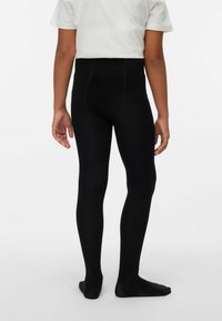 Knähöga svarta leggings med ribbad textur, sömlös design och hög midja, sedd bakifrån.