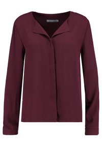 Blusa bordeaux a maniche lunghe realizzata in tessuto liscio, con colletto a punta e patta frontale, dal taglio morbido e orlo dritto.