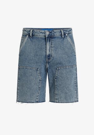 Jeansshorts i lys blå, med en avslappet passform, frynset kant og store frontlommer. Laget av strukturert denimstoff.