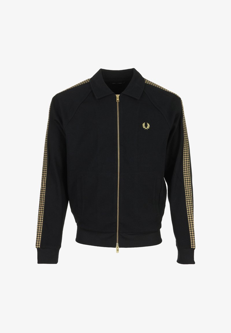 Zwarte jas met rits en kraag, gouden geruite strepen op de mouwen, en een klein goudkleurig lauwerkranslogo op de linkerborst.