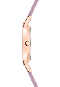 Runde Gehäuse aus Roségold mit einem lila Silikonarmband und einem auffälligen runden Krondetail an der Seite.