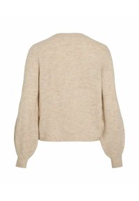 Pull en tricot beige avec de longues manches bouffantes et des poignets côtelés, vu de dos contre un fond blanc.